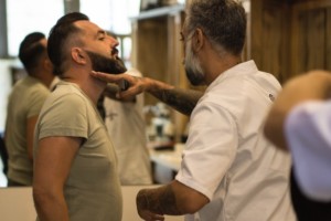 Barber gives client beard explanation at The Barbers Barbershop, hair grooming place for men only. Belgrade, Republic of Serbia.