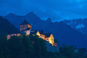 Vaduz Castle at twilight (night), Vaduz, Liechtenstein. The castle is the official residence of the Prince of Liechtenstein, and is the symbol of the country.