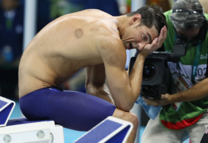 2016 Rio Olympics - Swimming - Final - Men's 4 x 200m Freestyle Relay Final - Olympic Aquatics Stadium - Rio de Janeiro, Brazil - 09/08/2016. Michael Phelps (USA) of USA reacts after his team won the gold medal. REUTERS/Stefan Wermuth FOR EDITORIAL USE ONLY. NOT FOR SALE FOR MARKETING OR ADVERTISING CAMPAIGNS.